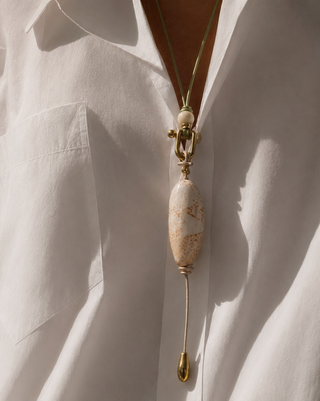 Handcrafted silk necklaces featuring natural gemstones, shells, and meaningful focal elements, designed to be worn, layered, and lived in