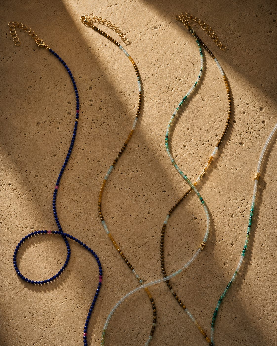 Signature Strand: 16 Inch Beaded Layering necklace featuring natural gemstones hand-strung with gold-plated details.
