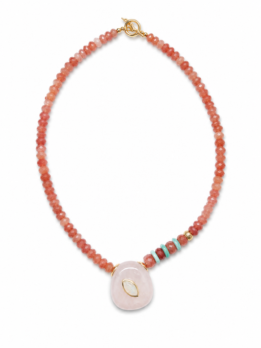 Seraphine focal necklace featuring a lavender amethyst pendant with hand-set rainbow moonstone, faceted sunstone beads, amazonite accents, and gold-plated findings.