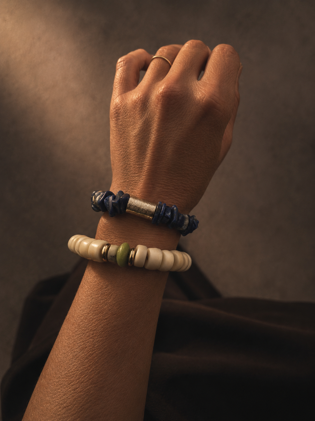 Hand wearing Calypsa and Nerina bracelets
